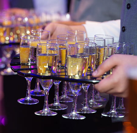 A group of glasses on a tray