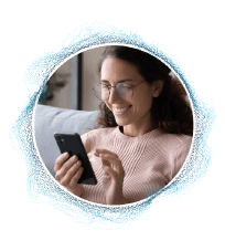 Person holding a mobile device in their hand.