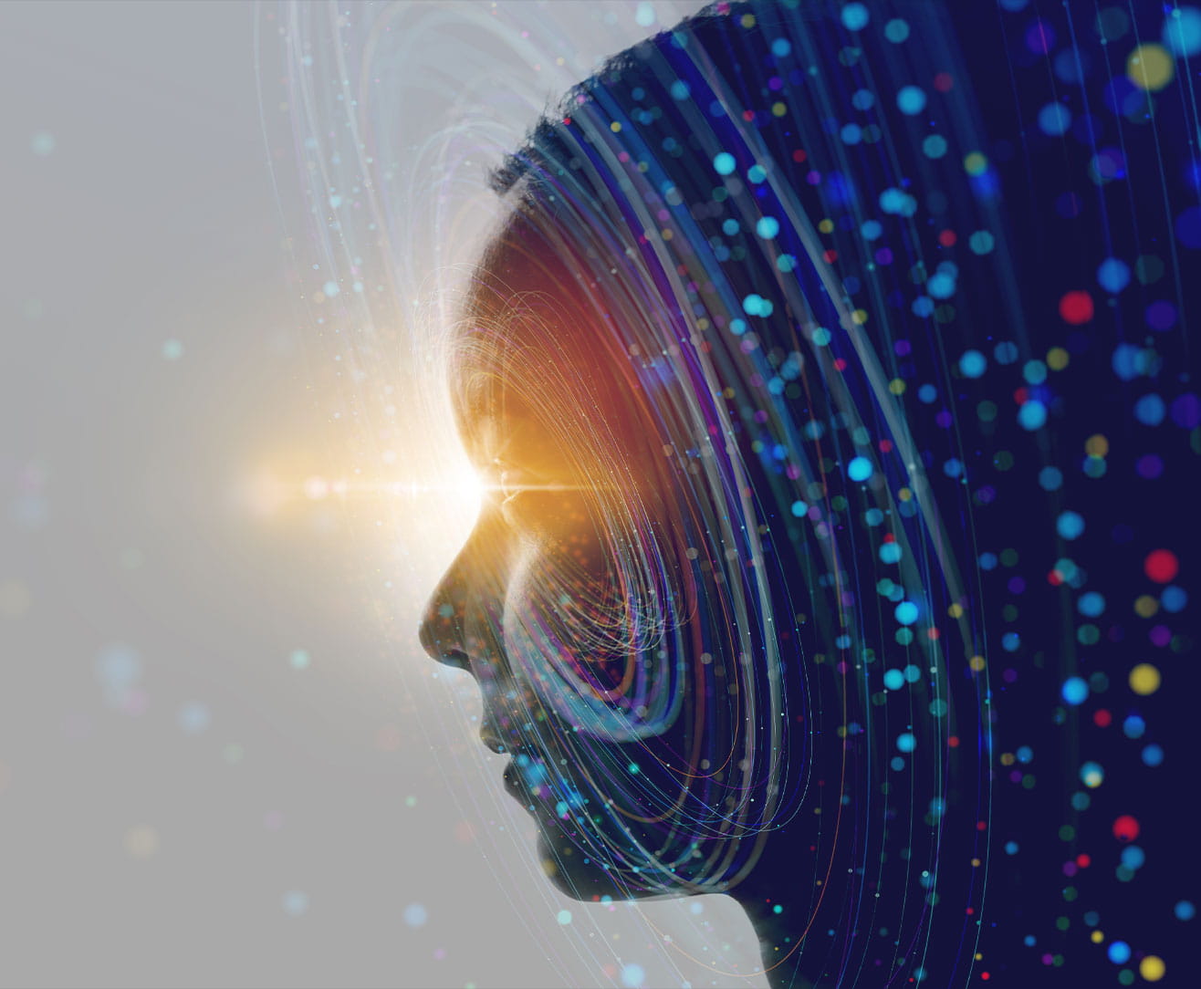 A digital silhouette of a woman's profile, illuminated with colorful light trails and specks.