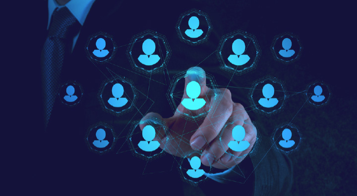 A professional's hand interacts with a digital network of connected user icons, symbolizing social connections.