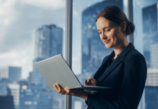 A person holding a laptop.