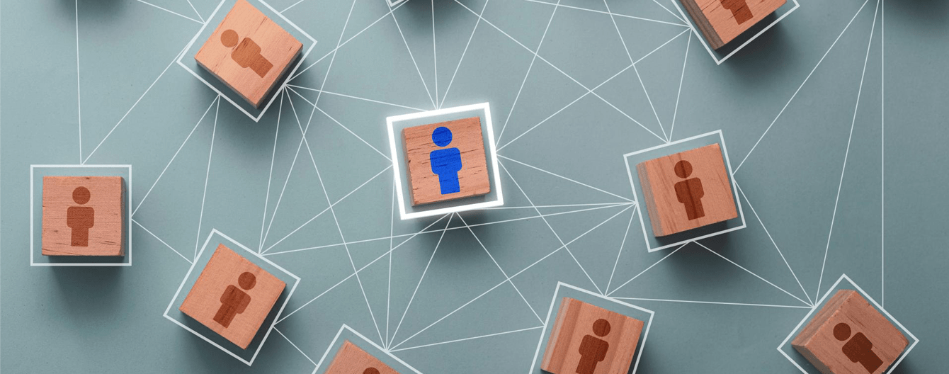 Wooden cube block print screen person icon which link connection network for organisation structure social network and teamwork concept.