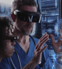 People wearing VR goggles analyzing a 3D model.