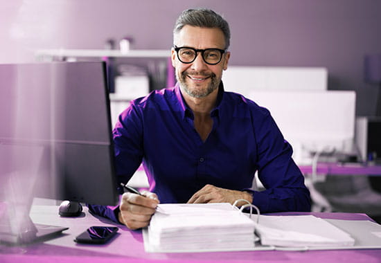 Disclosure expert working at his desk.