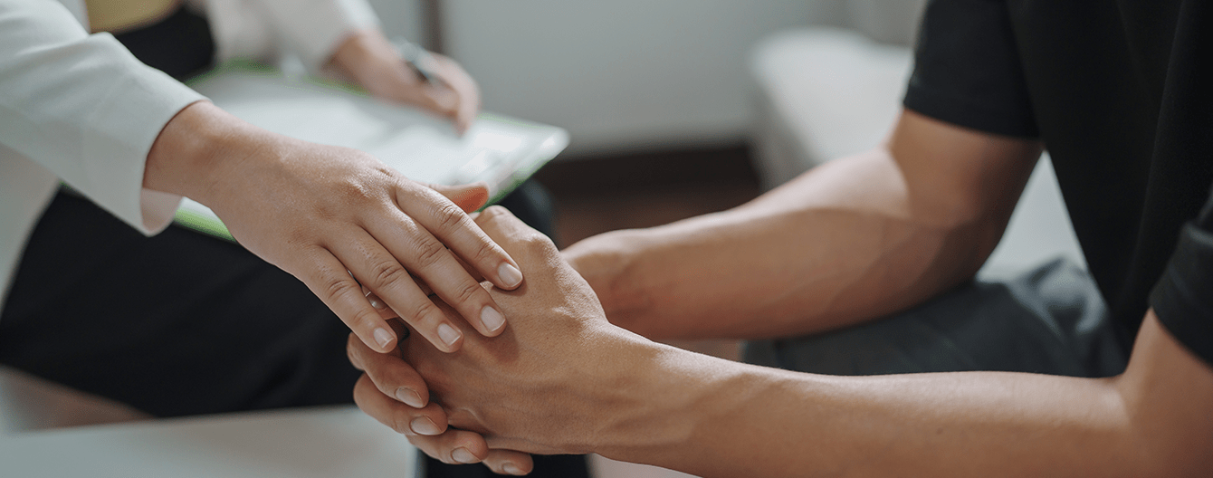 Comforting patient with clapsed hands