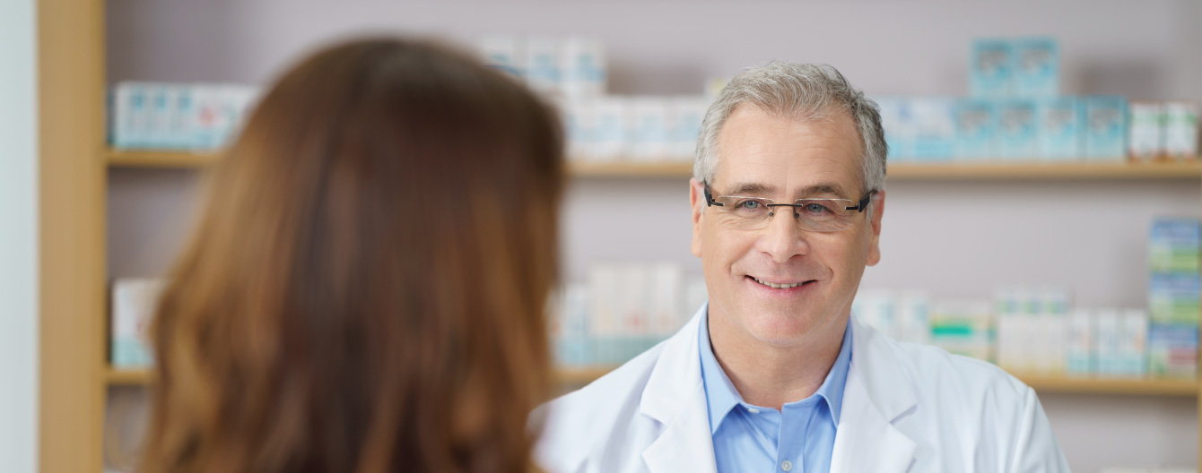 Healthcare worker and patient sitting across from one another.