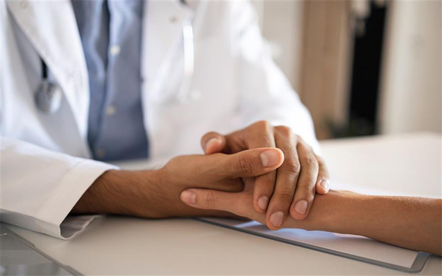 Friendly Doctor His Patient Holding Hands