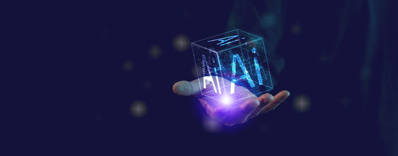 An illuminated hand holds a transparent cube with the letters "AI" glowing.