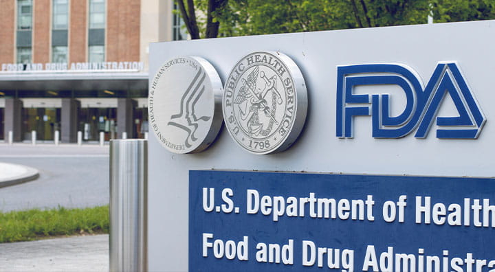Signage of the U.S. Department of Health and Human Services and FDA outside the Food and Drug Administration building.