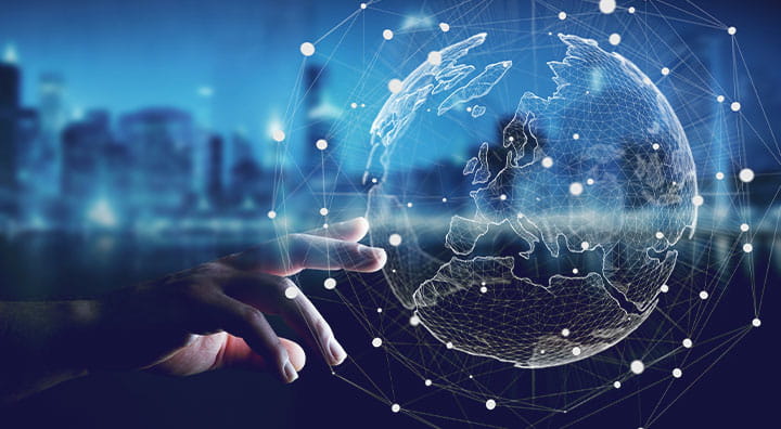 A hand reaching towards a digital globe surrounded by interconnected lines and dots, symbolizing technology and global connectivity.