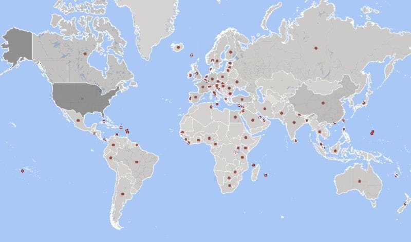 A world map highlights microstates and small territories with tiny red dots.