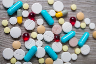 a group of pills and capsules