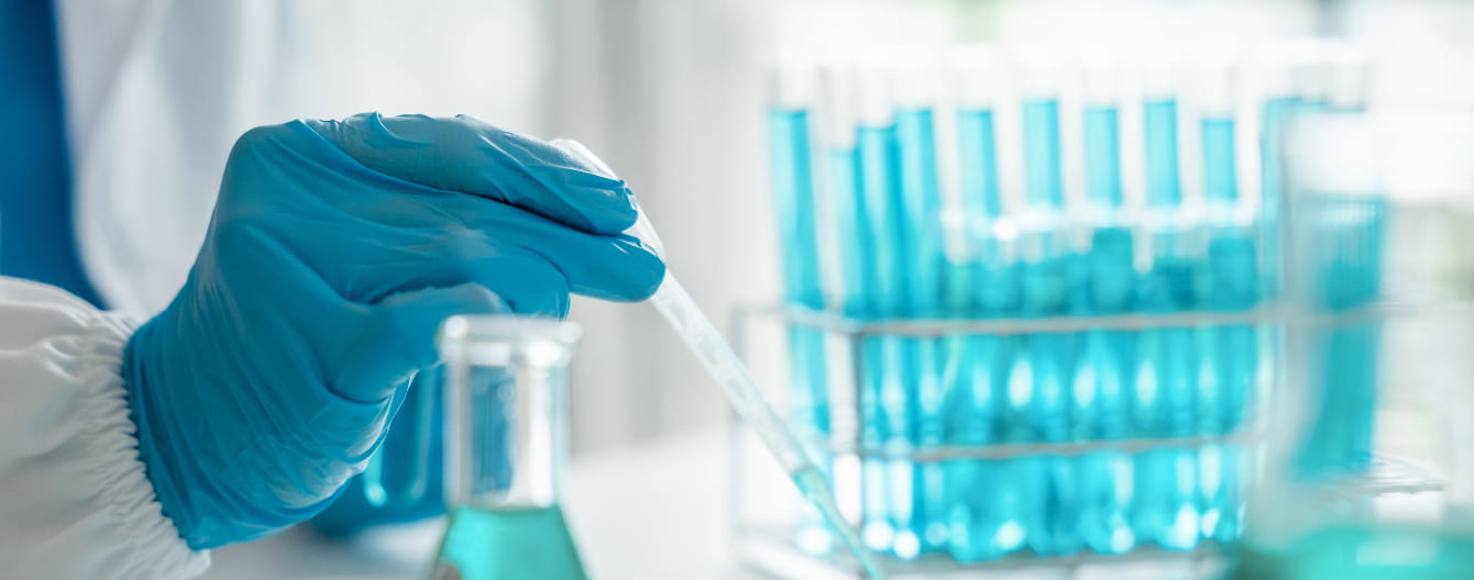 a man holding a test tube
