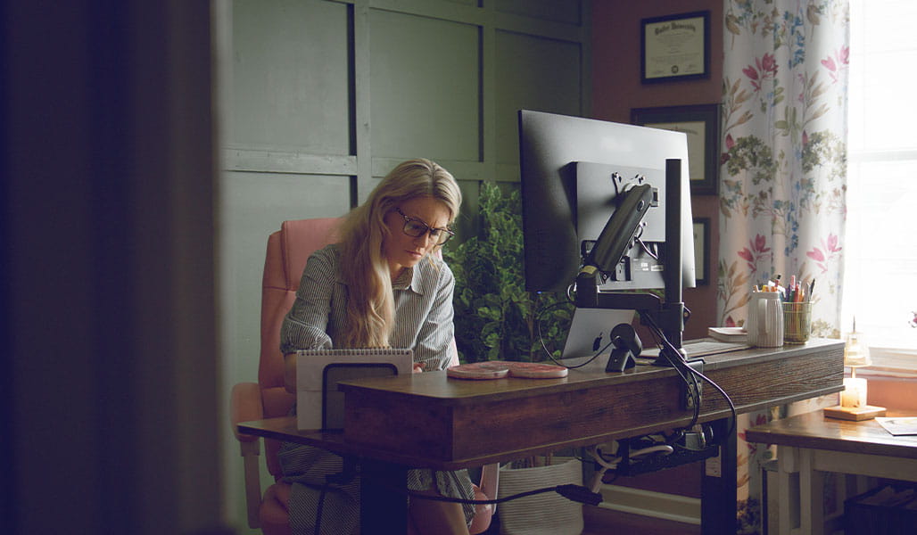 Madeline Naylor working in her home office.