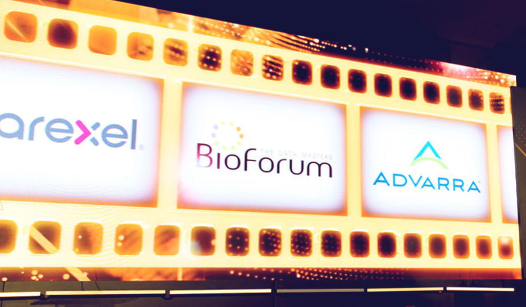 Stage featuring logos of the Scrip Awards sponsors. Logos include Paraxel, BioForum, and Advarra.